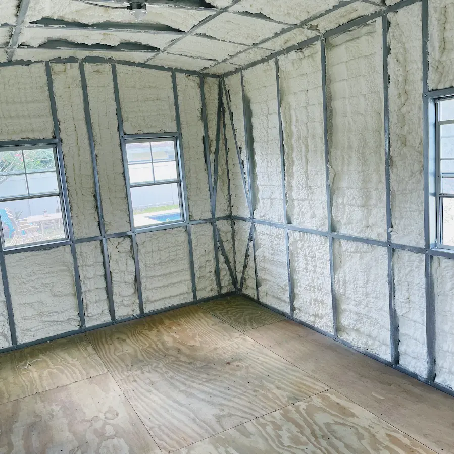 Closed-cell spray foam insulation applied to wall cavities in a residential project in Olyphant
